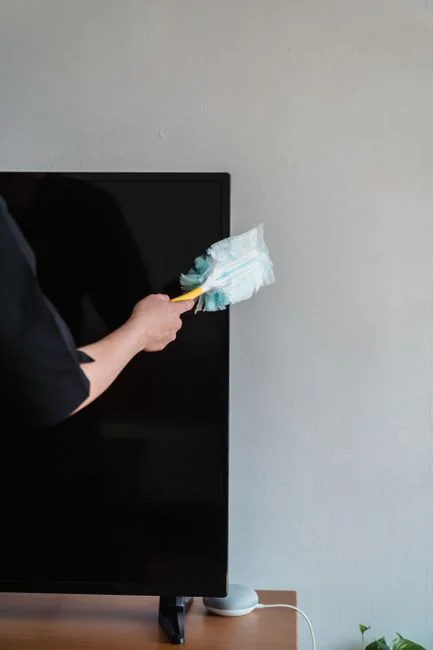 Window cleaner works on a high-rise glass building, ensuring spotless results.